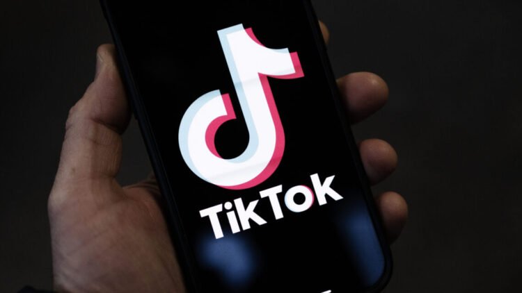 LONDON, ENGLAND - FEBRUARY 28: In this photo illustration, a TikTok logo is displayed on an iPhone on February 28, 2023 in London, England. This week, the US government and European Union's parliament have announced bans on installing the popular social media app on staff devices. (Photo by Dan Kitwood/Getty Images)
